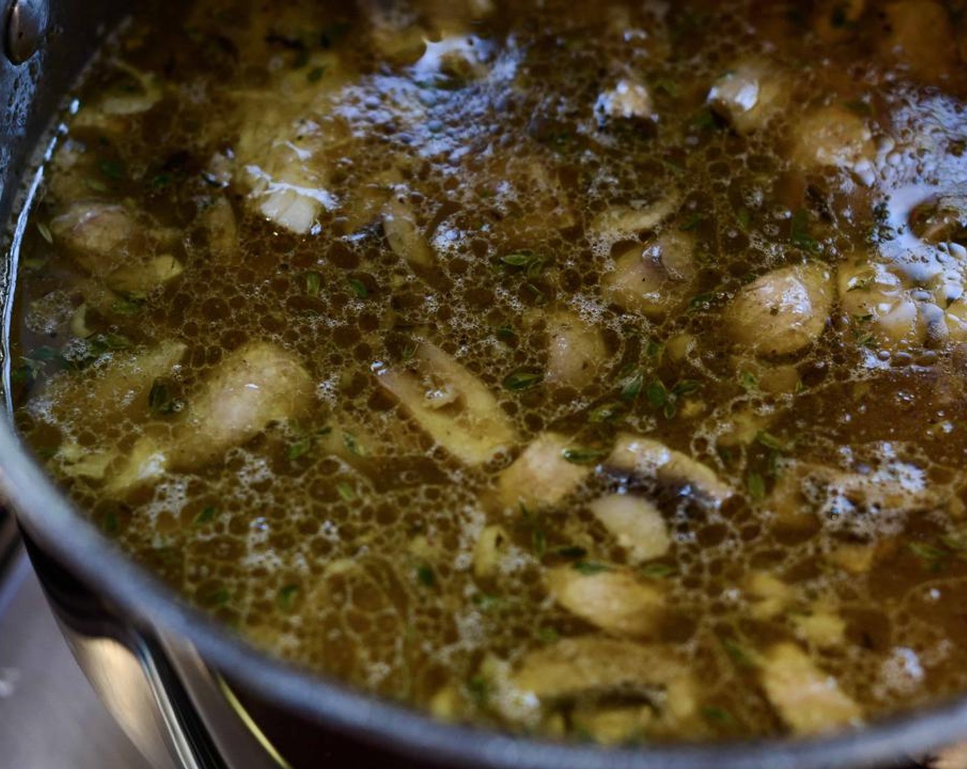 step 5 Fry on high for 5 minutes, tossing constantly. Add in the Sherry Wine (3 1/3 Tbsp) and simmer until reduced. Add the mushroom mixture into the simmering chicken stock and stir to combine. If using, add in the Stock Cube (1) and the shredded Roasted Chicken (to taste).