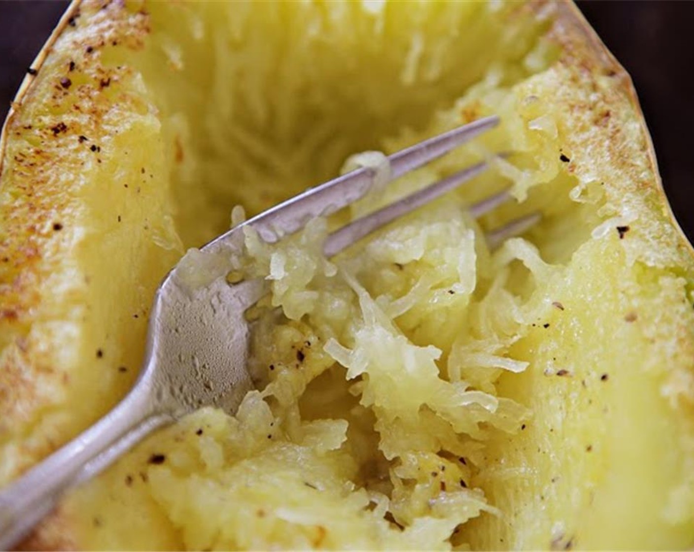 step 6 Once the squash is cooked, remove it from the oven, and allow it to cool slightly. Scrape out the strands of squash with a fork. Rewarm the pan with chard over medium heat, and add the spaghetti squash.