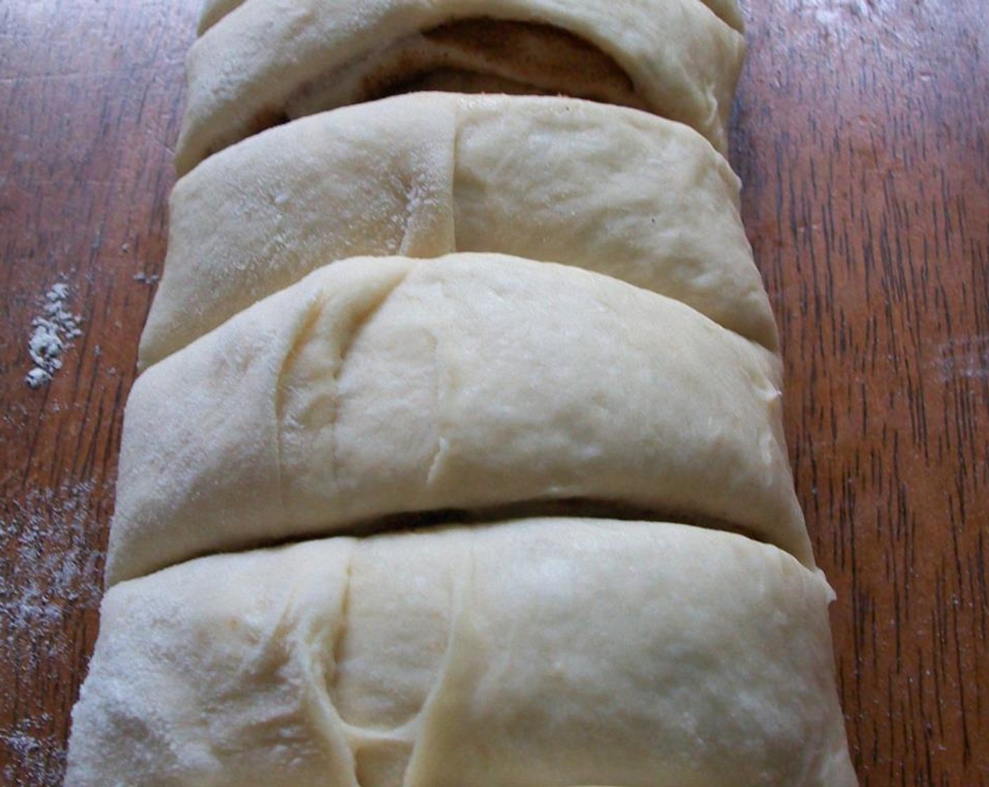 step 7 Roll up and pinch sides to hold sugar in. Cut into sixteen pieces.
