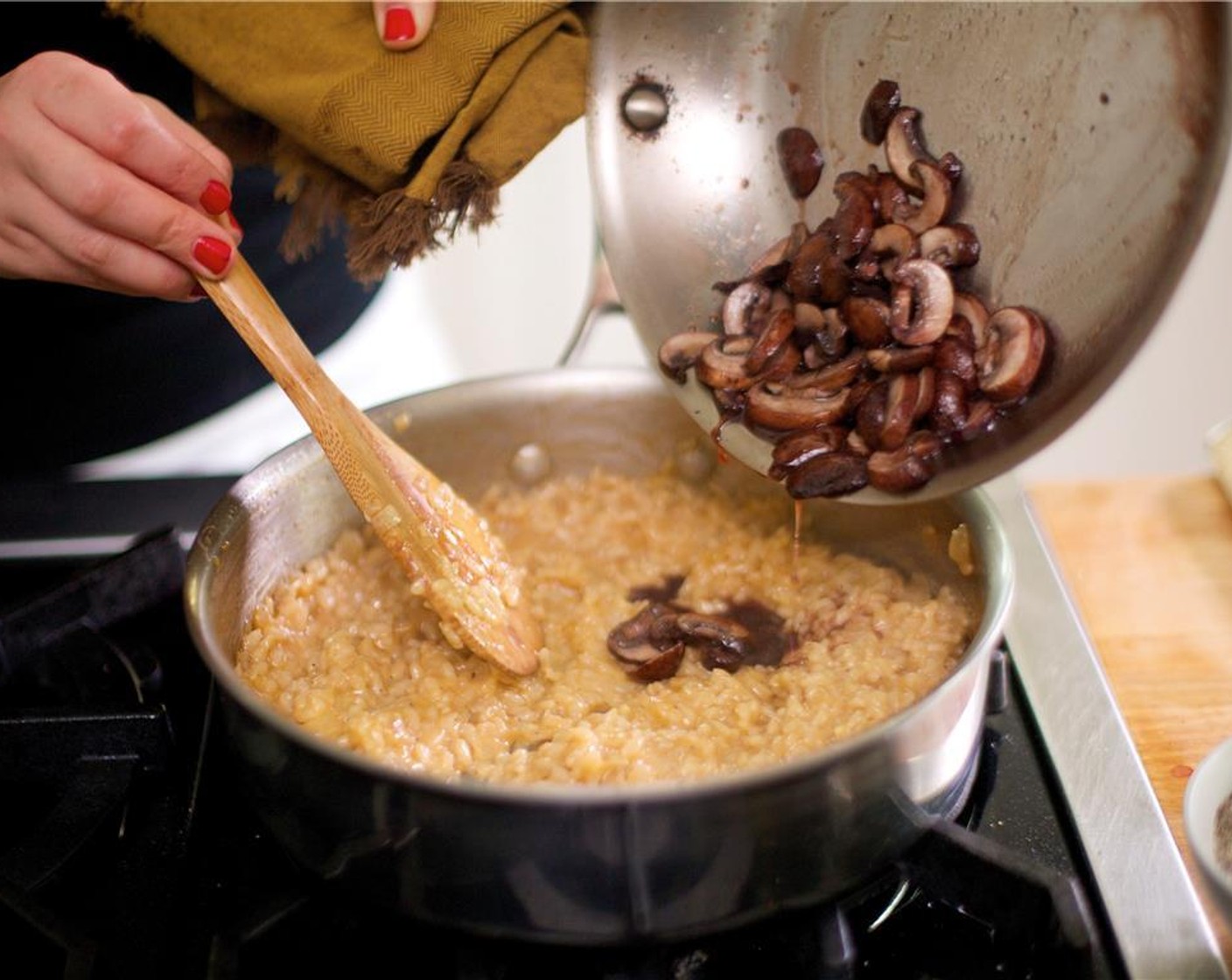 step 10 Once all the broth has been added and is absorbed, add the Butter (1/4 cup) and stir vigorously. The rice will become creamy. Add the Parmesan Cheese (1/4 cup), Salt (1/2 tsp), and Ground Black Pepper (1/4 tsp). Stir well to combine. Fold in the mushrooms.