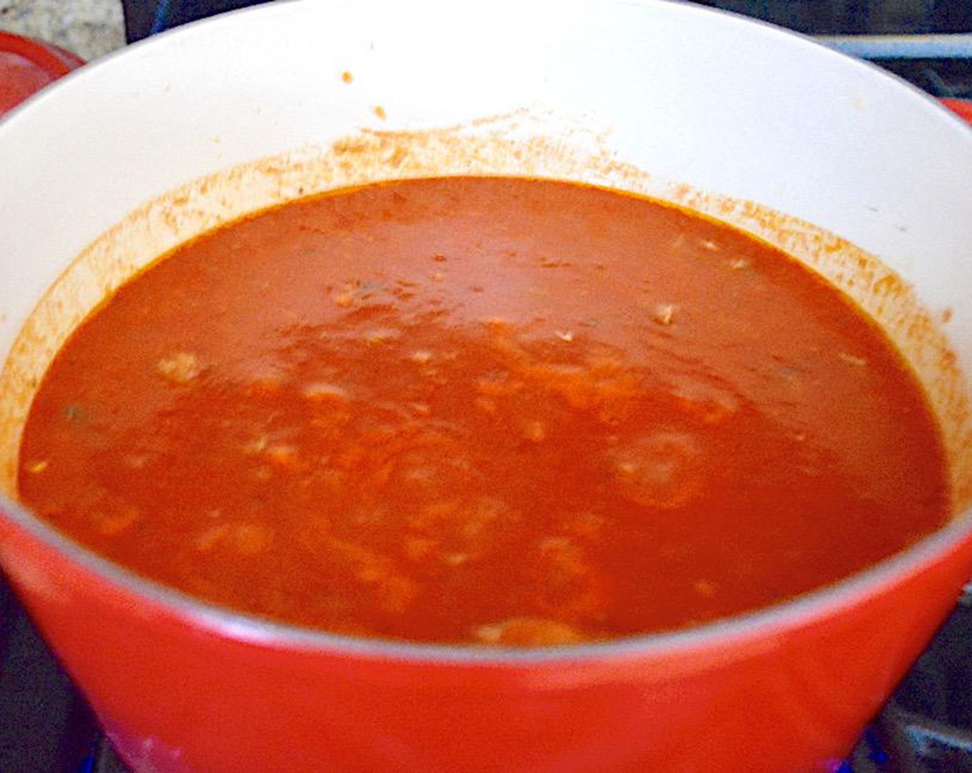 step 4 Then pour in the Marinara Sauce (1 jar), Crushed Tomatoes (1 can), and Chicken Stock (2 cups). Bring the soup to a gentle boil, then reduce it to a simmer. Let it cook for 30 minutes.