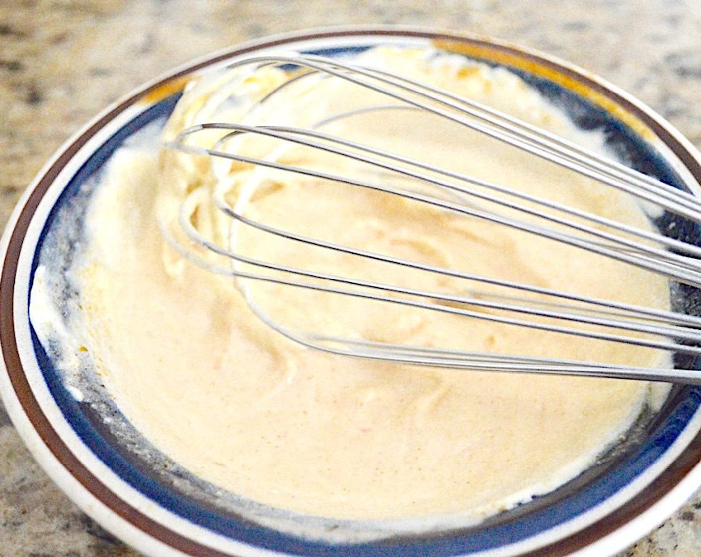 step 5 When the time is almost up, get a pot of water on to boil for the Egg Noodles (1 lb). While it comes to a boil, combine the Crème Fraîche (1/2 cup) and All-Purpose Flour (1 Tbsp) in a bowl and whisk them together. Then add in a couple spoonfuls of the flavorful chicken broth and whisk it in to temper it.