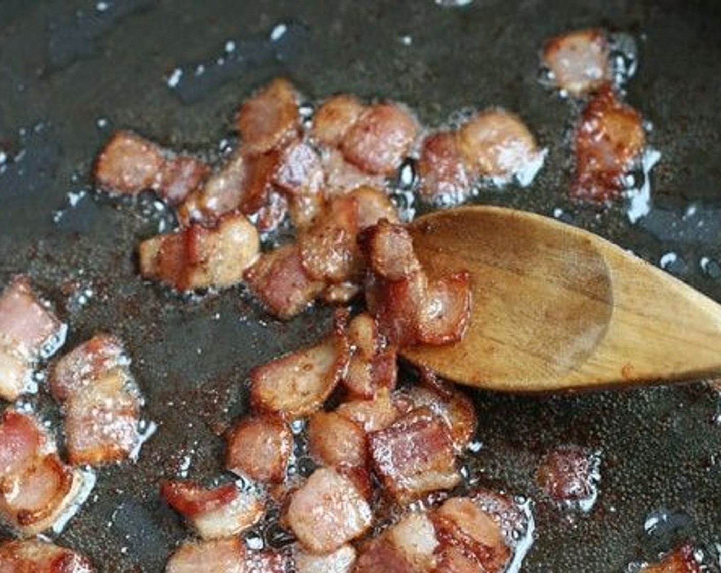 step 4 Over medium-low heat, saute the Smoked Bacon (4 slices) until lightly crispy. Scoop bacon out into the short rib pan. Return skillet, with some oil still in it, to the stovetop.