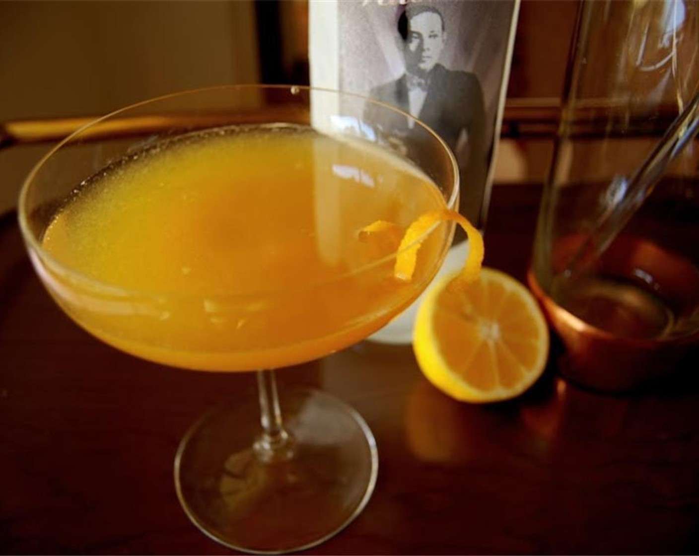 step 2 Pour over a strainer into a chilled glass and garnish with an orange twist. Enjoy!