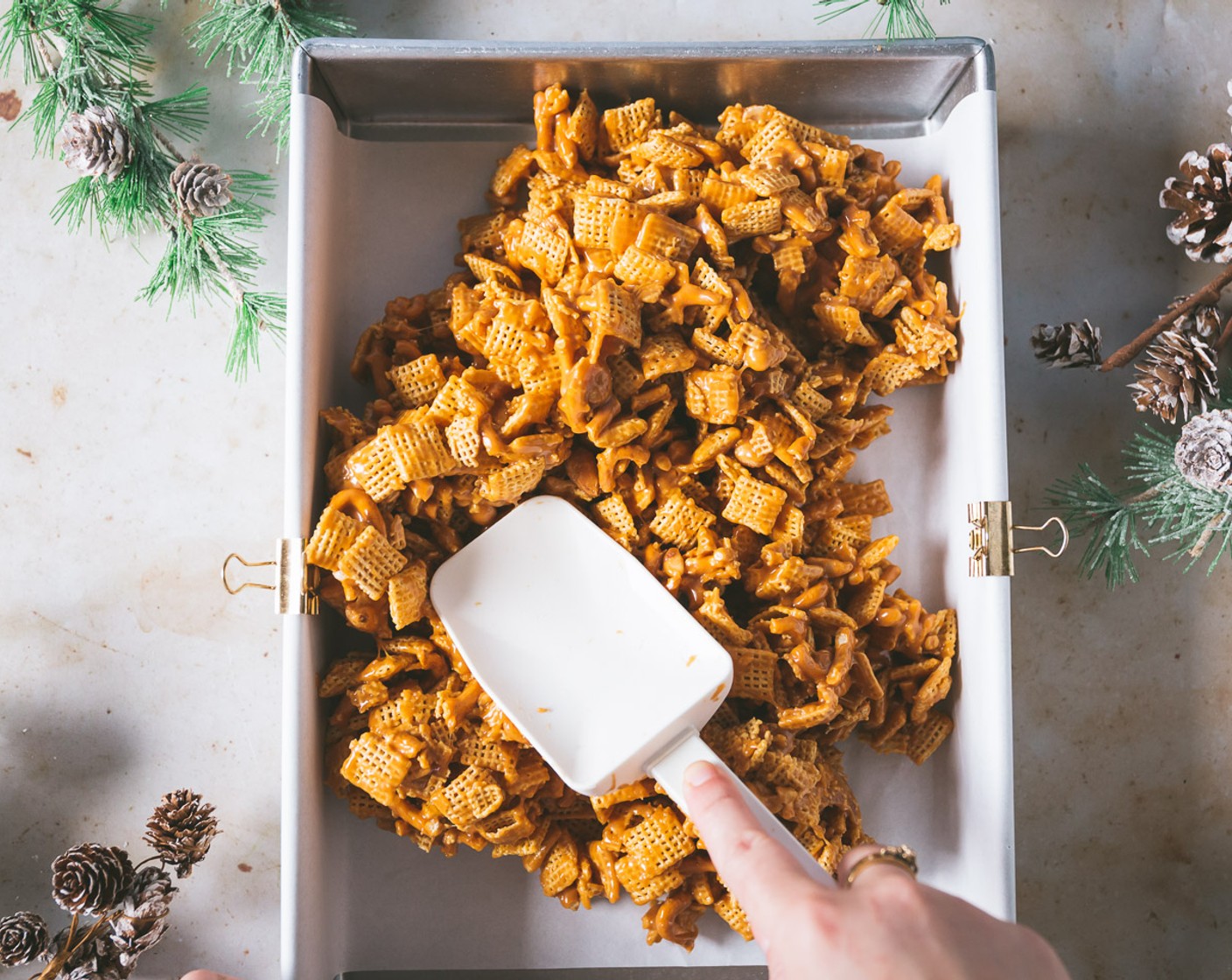 step 3 Remove from the heat. Add the Vanilla Extract (1 tsp) and stir. Mix in the Corn Chex® Cereal (5 cups), Salted Pretzels (1 1/2 cups), Peanuts (1/2 cup). Spread the mix out into the prepared baking dish.