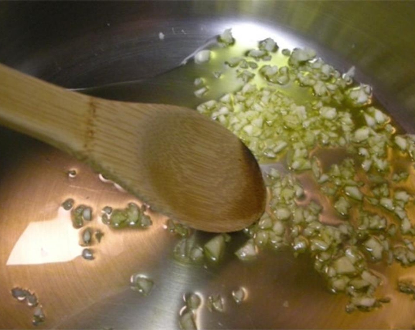 step 2 Preheat Canola Oil (1 Tbsp) in a pan over medium heat. Add the Garlic (2 cloves) and saute until fragrant.