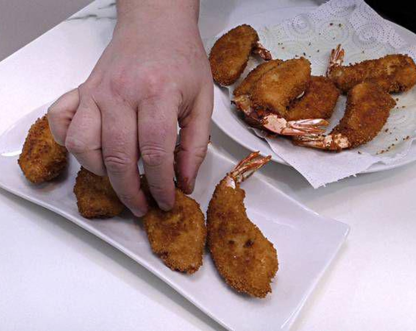 step 5 As they finish frying remove from the oil and place on a plate with paper towels to dry off excess oil.