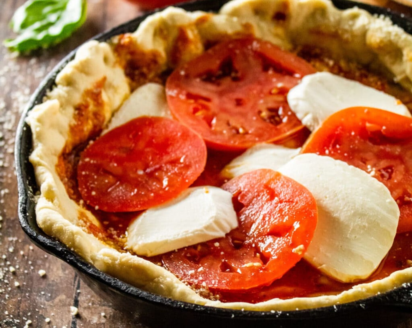 step 10 Once the crust is pre-baked, top with Marinara Sauce (1 cup), Mozzarella Cheese (2 cups), and Tomato (1). Each pizza should take about ½ cup of marinara sauce, 4 ounces of sliced fresh mozzarella, and ½ of the tomato that has been sliced. Alternate the slices of tomato and mozzarella on top of the sauce.