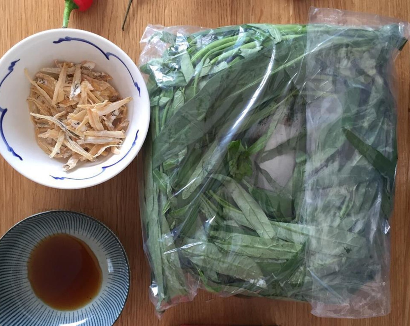 step 1 Gather the ingredients. Separate the the leaves of the Chinese Water Spinach (1 bunch) from the stems, and set both aside.