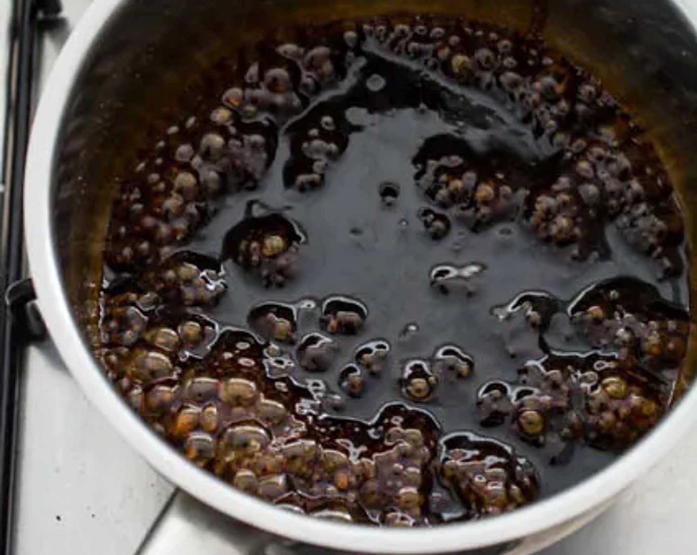 step 6 Mix Corn Starch (1 tsp) with Water (2 Tbsp) in a small bowl. Stir well till this mixture is smooth. When the sauce starts to boil, pour the cornstarch mixture into the saucepan. Keep string until the sauce thickens, then set aside.