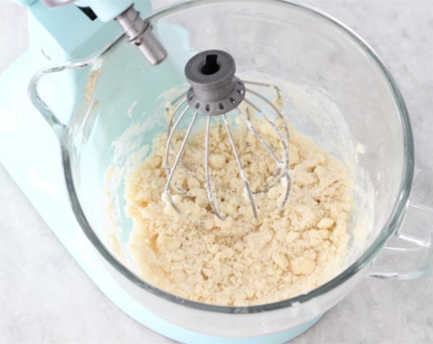 step 4 Using a stand mixer or a hand mixer, on low speed, and add the Butter (1/2 cup) to the flour mixture, one piece at a time, just until you get coarse crumbs, you definitely don’t want to mix it too much.