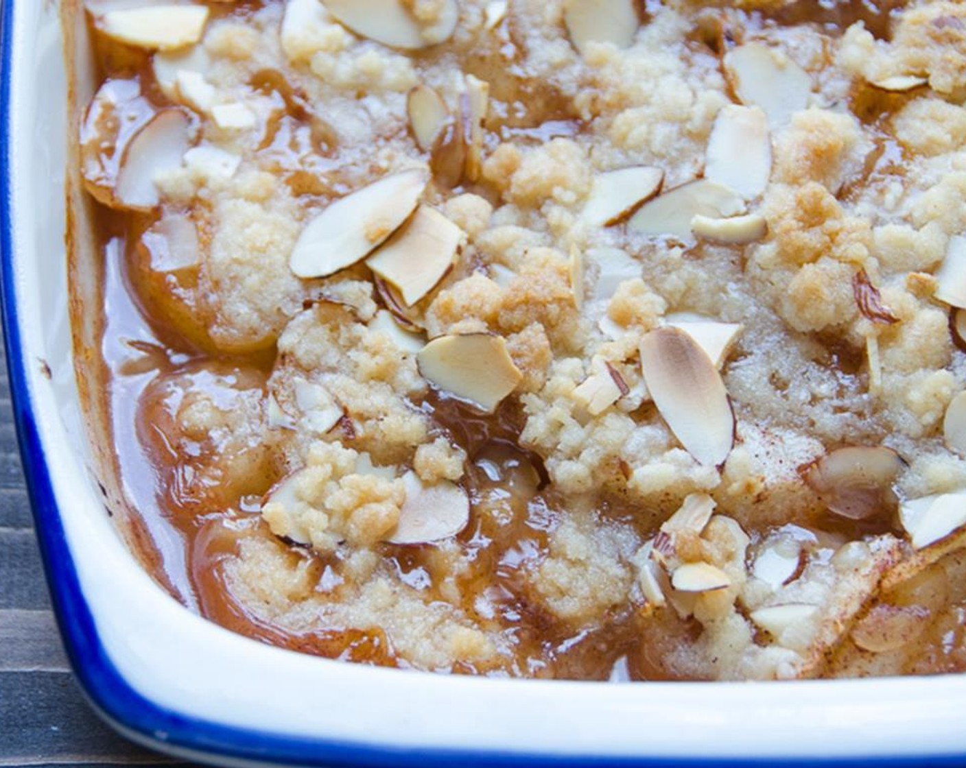 step 9 Liberally sprinkle the almond topping over the pear filling. Bake for 50 minutes to an hour until the fruit is tender, but not mushy and the topping is a warm, golden color.