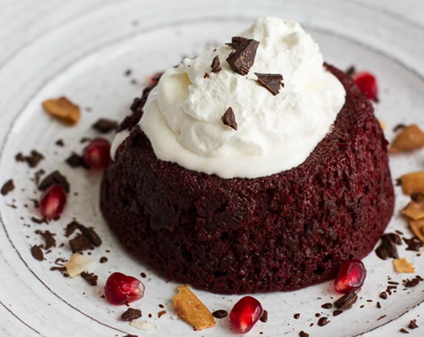 step 11 Loosen the edges of the cakes with a butter knife and turn out onto plates. Serve immediately with Whipped Cream (to taste). Feel free to add some Toasted Toasted Coconut Flakes (to taste), Chocolate (to taste), and Pomegranate Seeds (to taste).