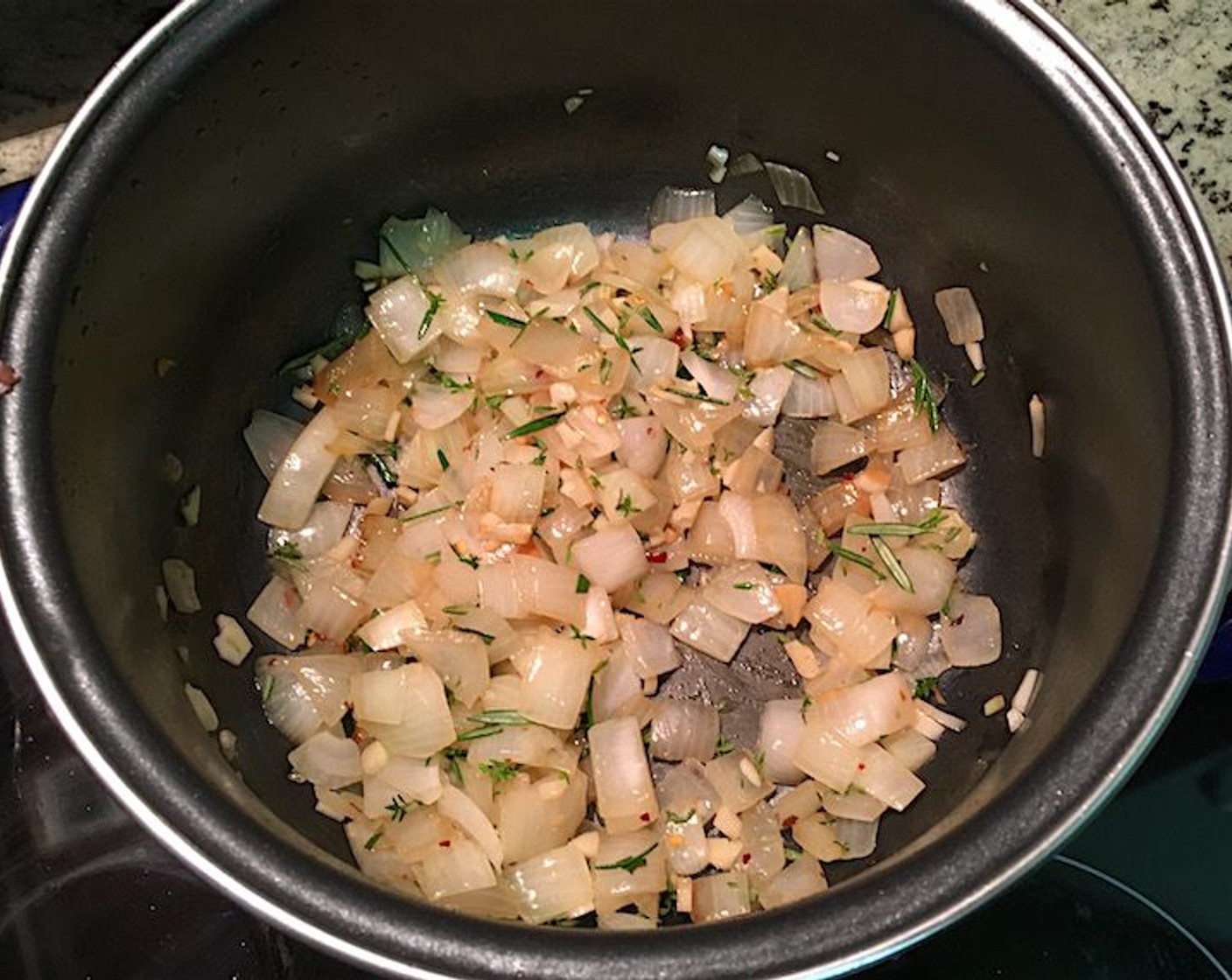 step 16 Add the remaining sliced garlic, chopped rosemary, Fresh Thyme (5 sprigs), Smoked Paprika (1/2 tsp) and Cayenne Pepper (1 pinch) to the pot with the onions and stir to combine.