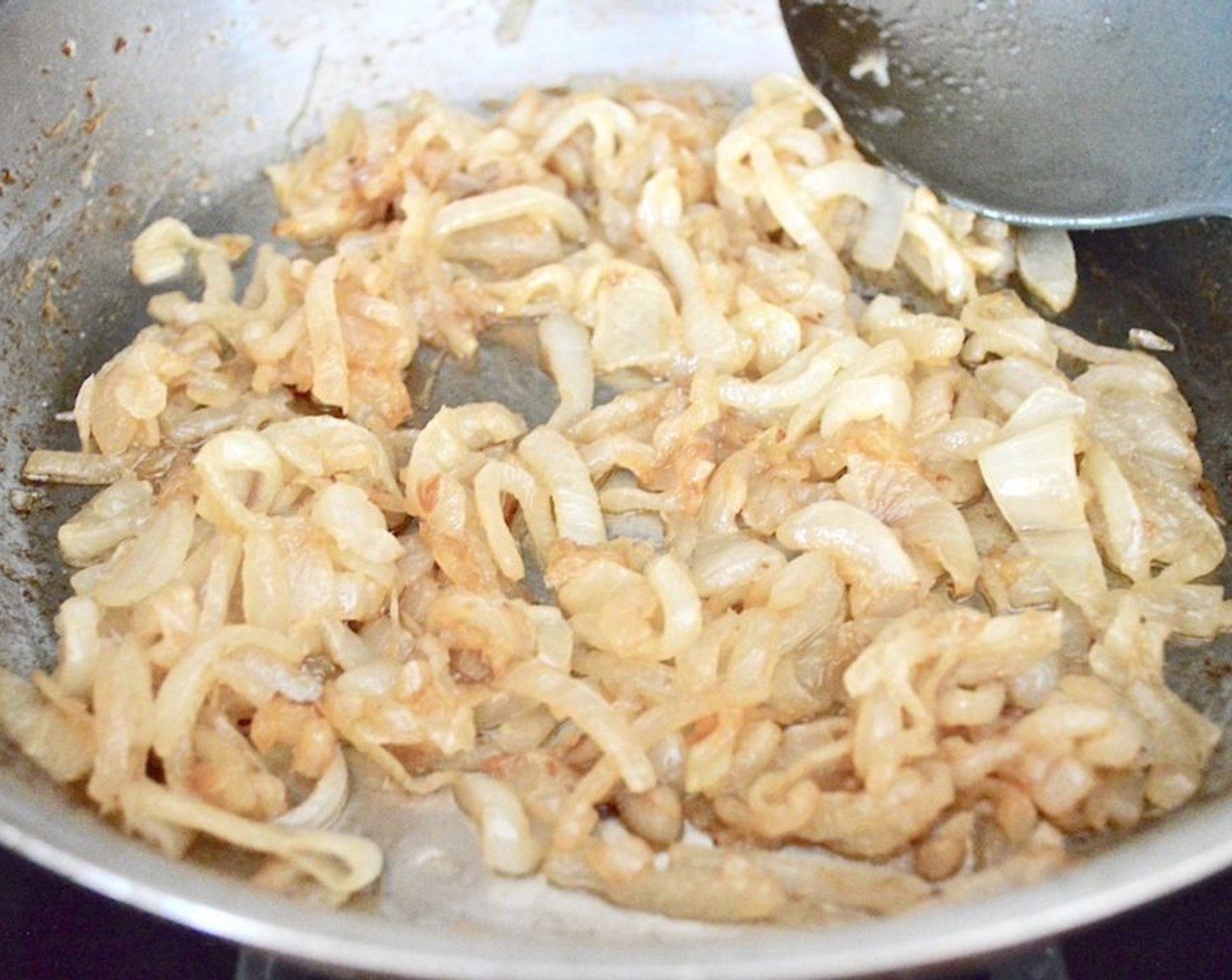 step 2 Add the Onions (3). Turn the heat to medium and let the onions cook for 8-10 minutes. Every couple of minutes, add a tablespoon of Water (1/4 cup) to keep the bottom from burning the onions. Stir them often and let the onions become a lovely golden brown color. Set them aside when they are done.