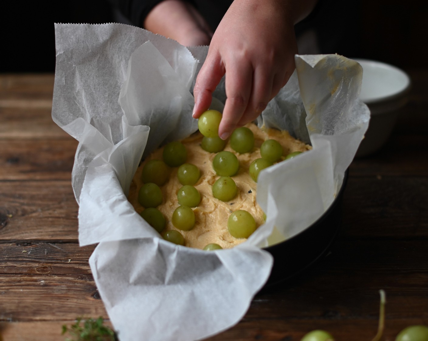 step 6 Pour the batter into the springform tin and arrange the Green Grapes (3 3/4 cups) on top.