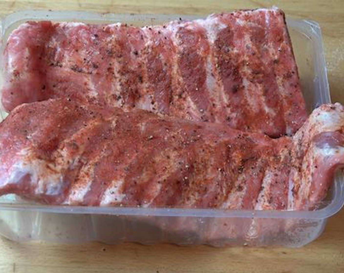 step 1 Start by seasoning the Pork Ribs (2.2 lb) with Salt (to taste), Ground Black Pepper (to taste), and Smoked Paprika (to taste). Use your fingers to rub the seasoning evenly on the ribs, and repeat on the other side.