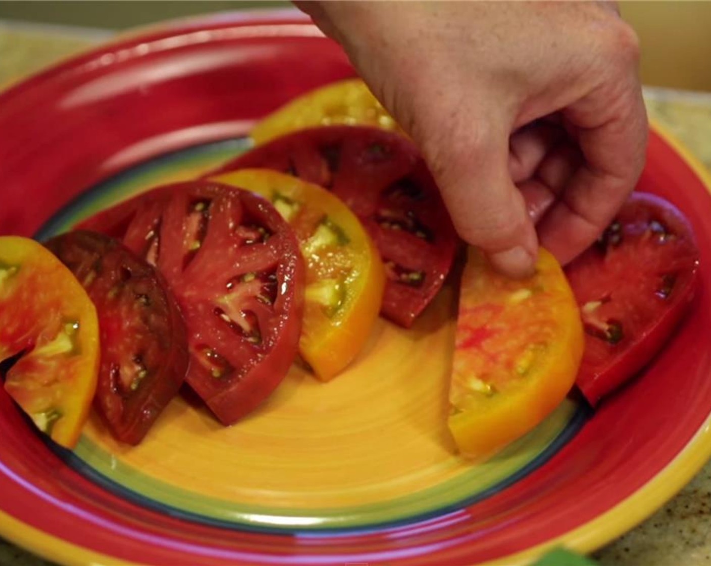 step 6 Overlap tomatoes on a large platter or individual salad plates (alternating colors if using red & yellow varieties), with a thin slice of mozzarella between slices.