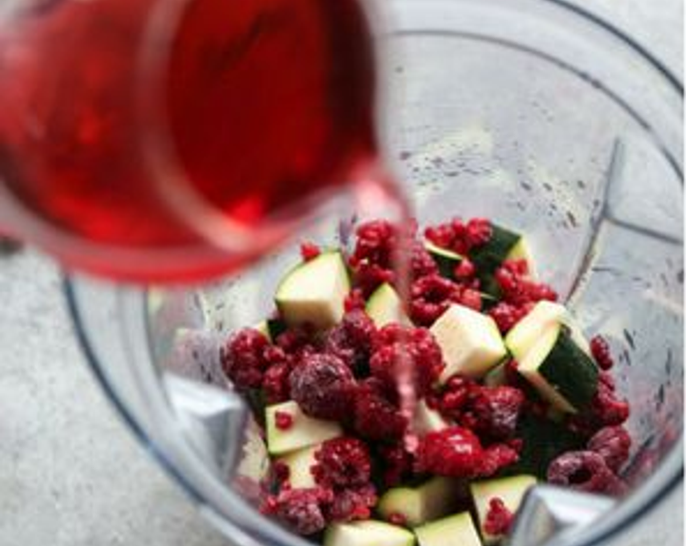 step 2 In a blender bowl, combine the Fresh Ginger (1.3 cm), Zucchini (1), Frozen Raspberries (115 g), Almond Milk (120 mL) and hibiscus concentrate. Puree until smooth, adding more hibiscus concentrate or nut milk until you reach your desired consistency.
