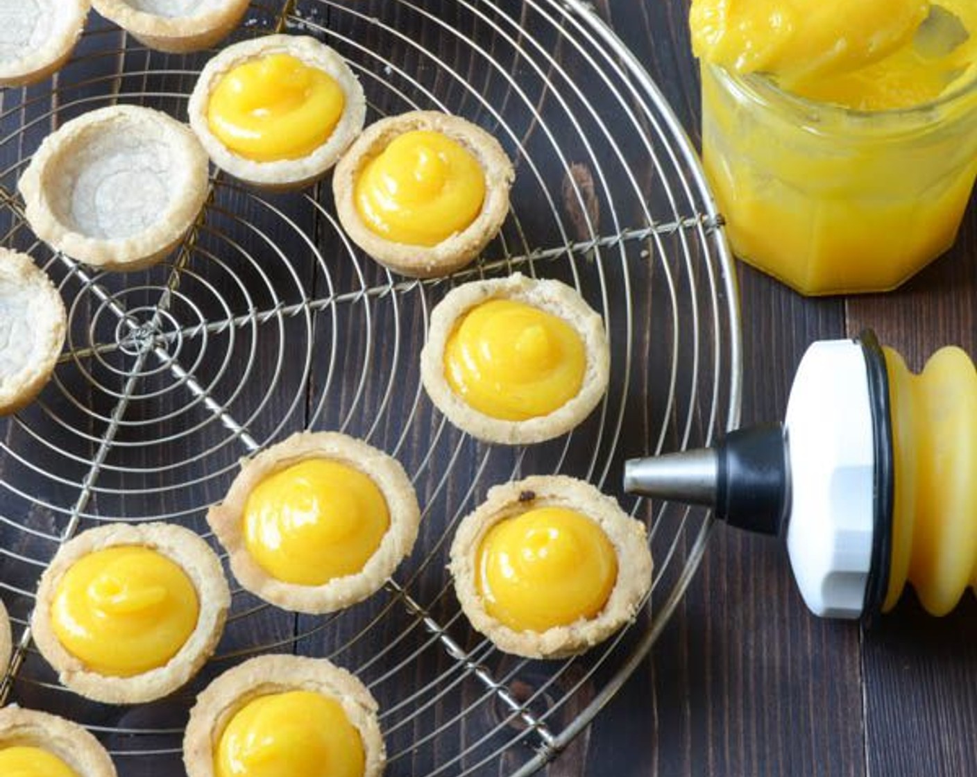 step 19 When shells are at room temperature, pipe or spoon the passion fruit curd into the shortbread shells.