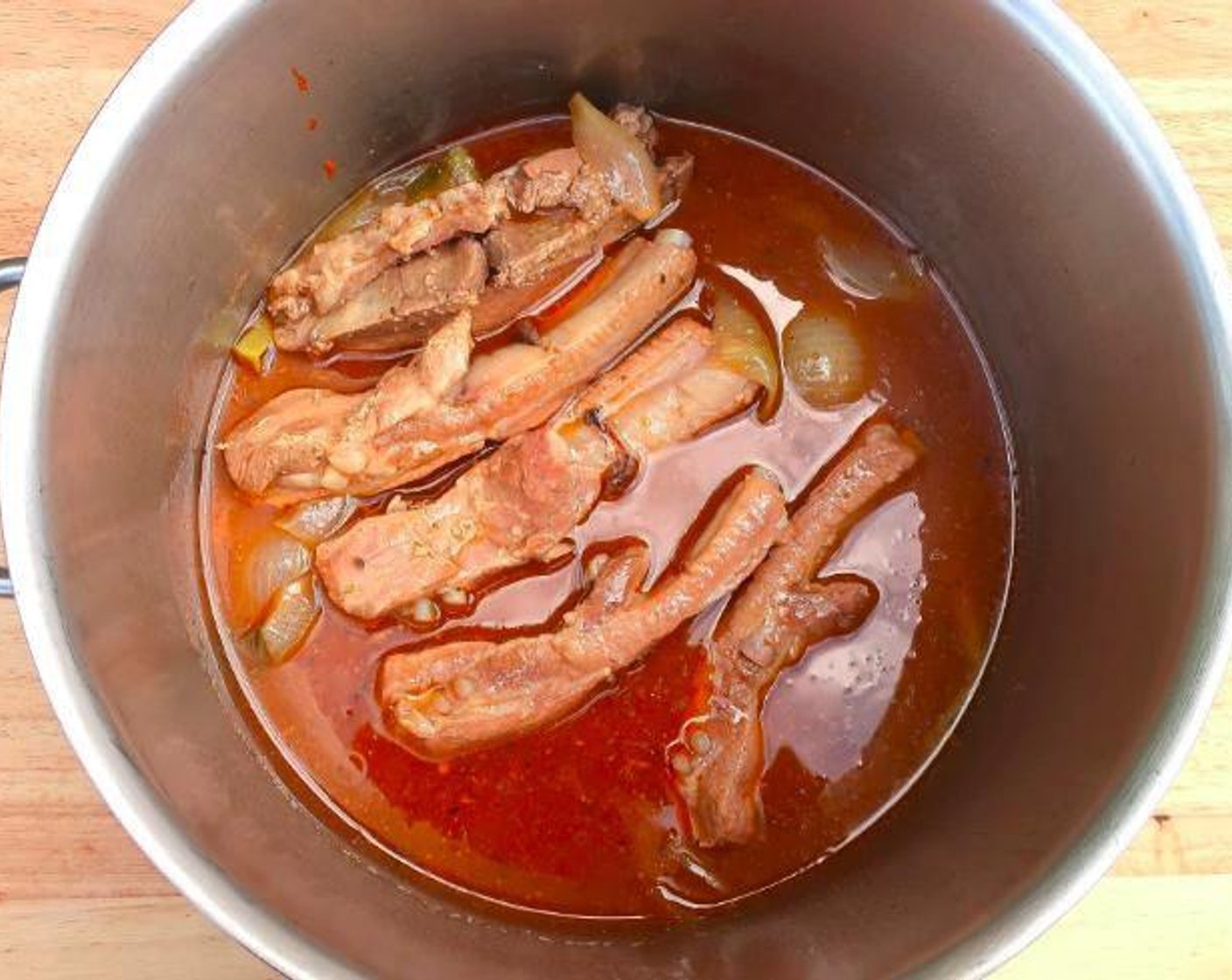 step 2 Simmer pork until very tender, but not falling apart. There should be about 1 quart of stock remaining; if not, adjust with water and additional seasonings. This should take an hour or more depending on the thickness.