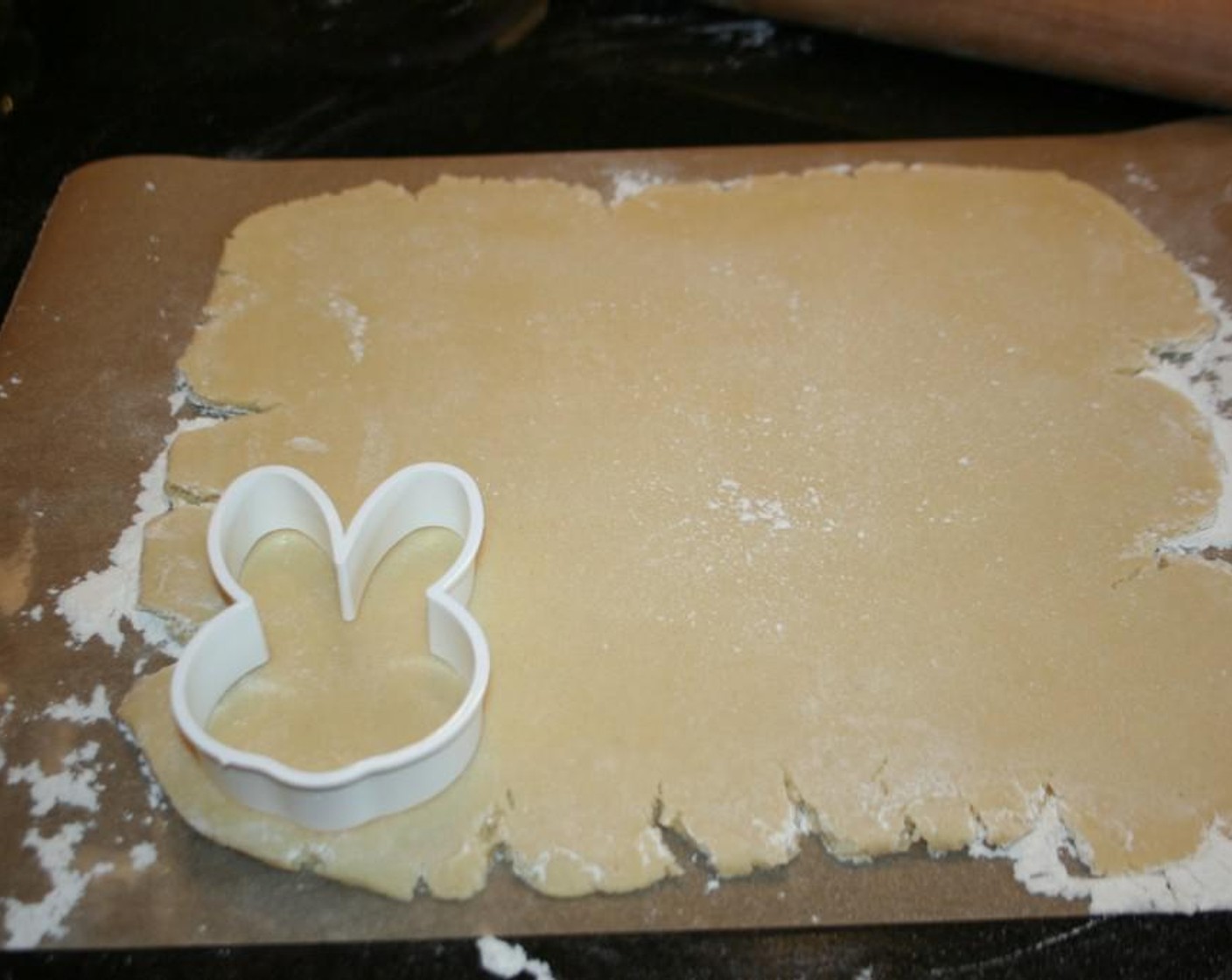 step 4 Roll cookies out on a floured surface. Bake cookies on a parchment paper lined baking dish. I roll the cookies rather thick I like them about 1/8 inch thick. I bake the cookies for 10-14 minutes. Let cookies cool completely on a wire rack before icing.