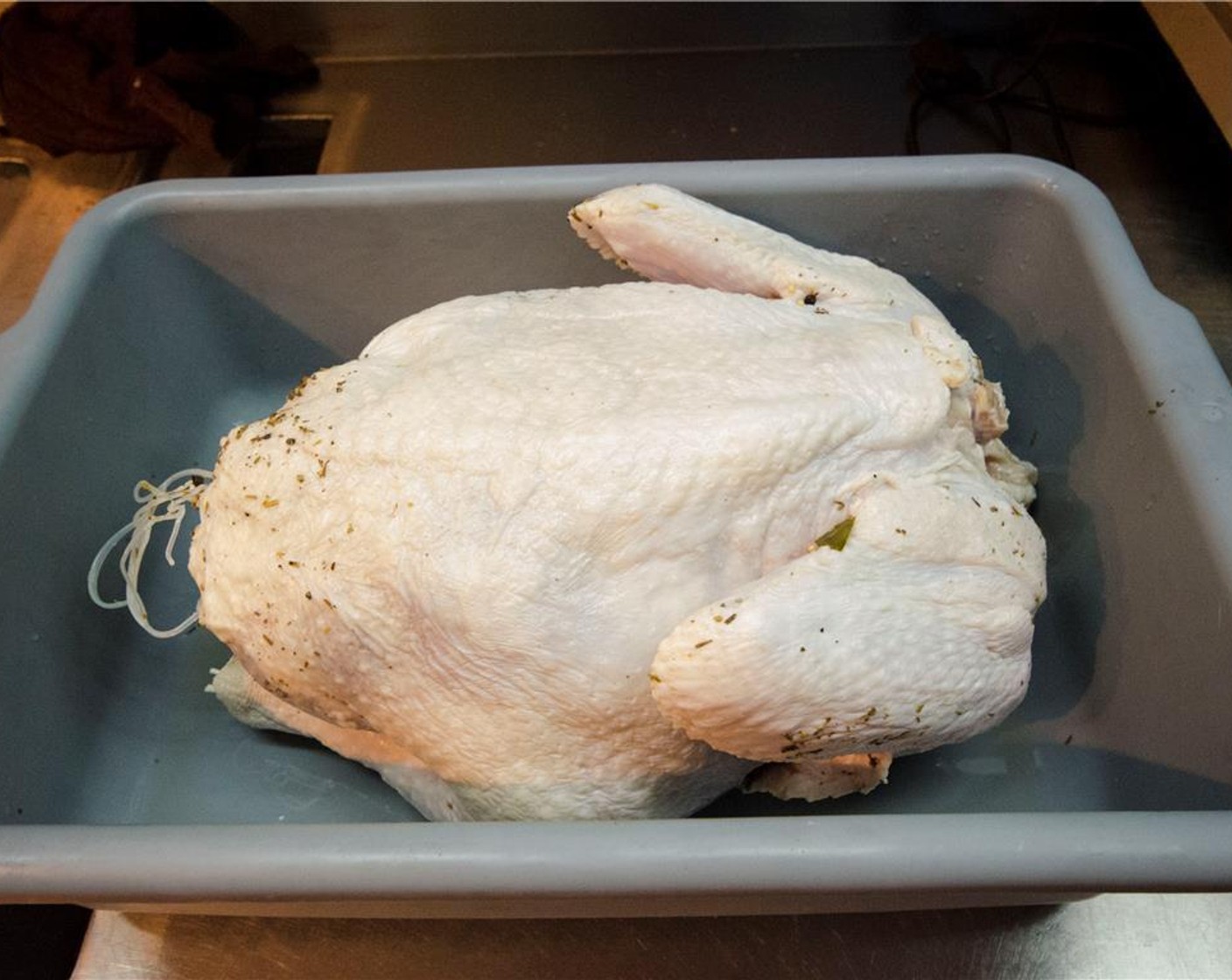 step 3 Remove turkey from the brine solution. Wipe off any excess spices, and let it sit for an hour to dry off and come to room temperature.