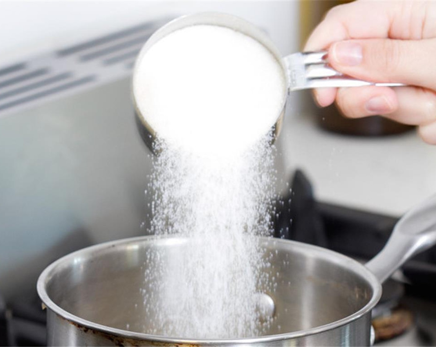 step 1 Put the Water (1 cup) and Granulated Sugar (1 cup) in a small saucepan. Heat on the stovetop over low heat.