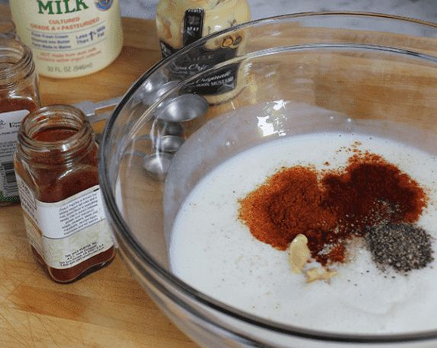 step 1 In a large bowl, whisk together the Buttermilk (2 cups), Dijon Mustard (1/2 Tbsp), Paprika (1 tsp), Cayenne Pepper (1/4 tsp), 2 tsp Kosher Salt (to taste), and 1/2 tsp Freshly Ground Black Pepper (to taste). Add the Garlic (2 cloves), Shallot (1), and Jalapeño Pepper (1).