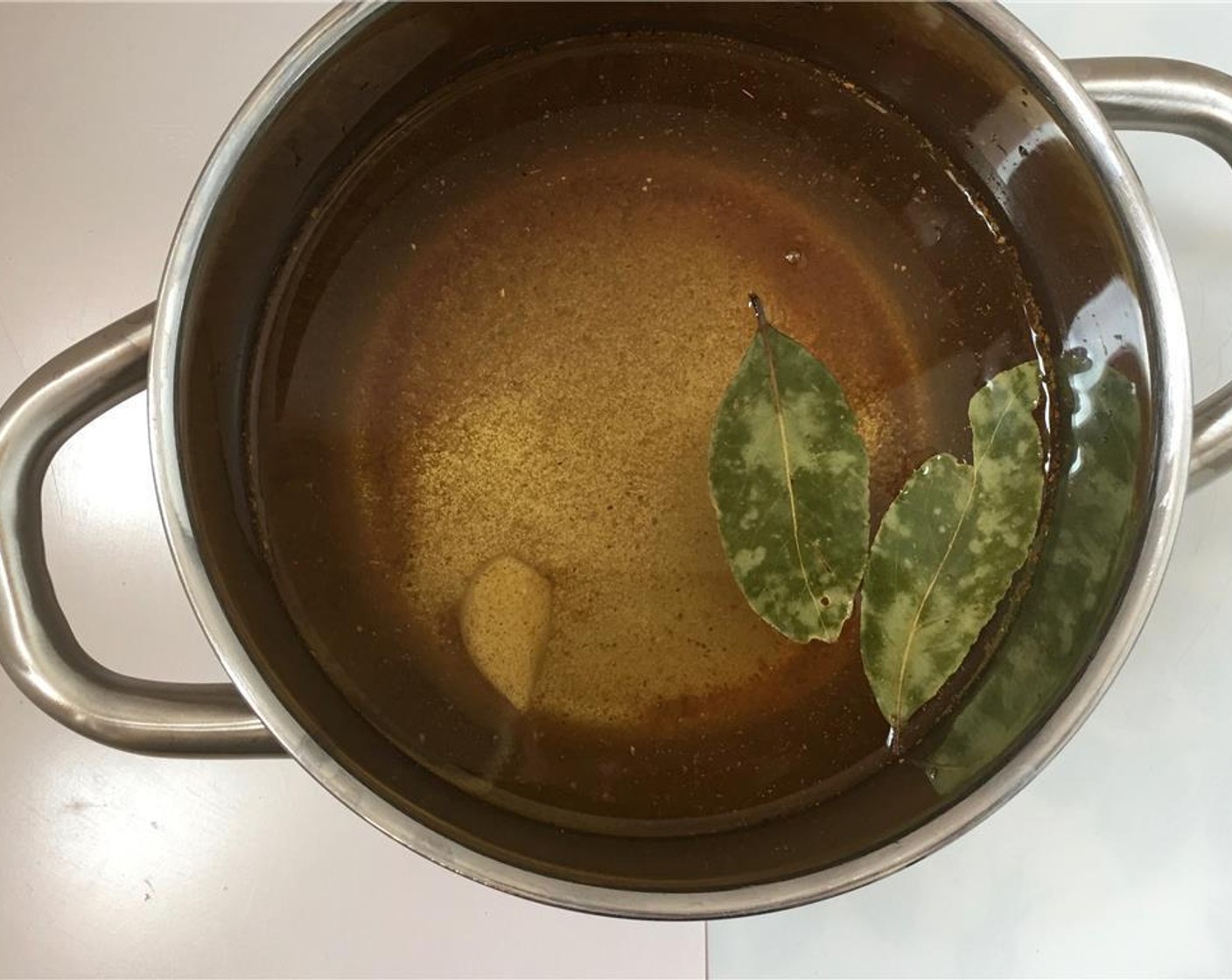 step 1 Fill a large and high pan with tap water and add 2 teaspoons of the Old Bay® Seasoning (1 Tbsp), Garlic (1 clove), and Bay Leaves (2). Season with a good dash of Salt (to taste) and Ground Black Pepper (to taste).