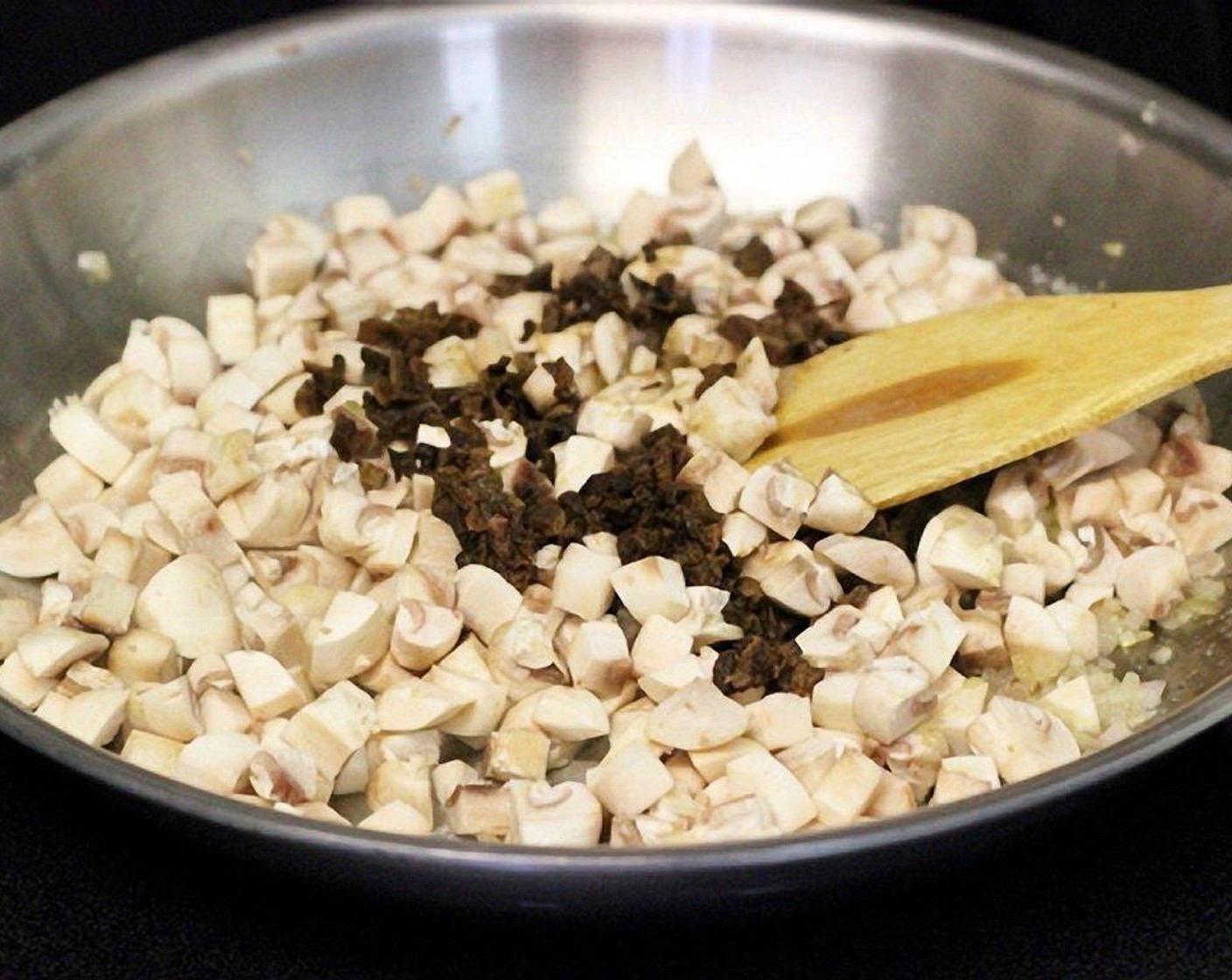 step 8 Add both of the mushrooms. Season with salt and pepper. Cook for about 7 minutes until the mushroom are softened, and all the liquid is evaporated.