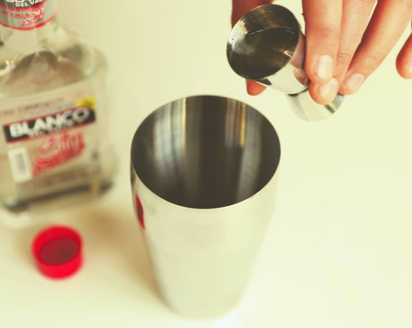 step 3 Add Aguardiente (1.5 fl oz) to the shaker.