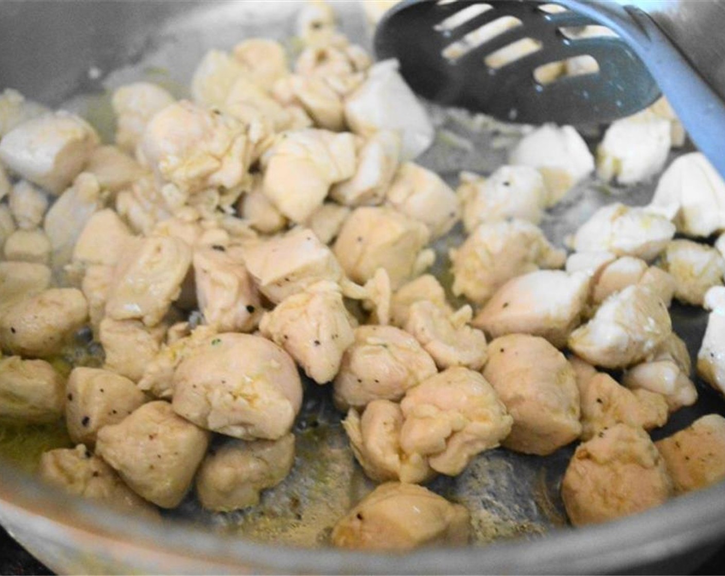 step 6 Get the Chicken Tenders (1 lb) into the large skillet and let it get completely cooked through and slightly golden on the outside for about 5 minutes. Remove it to a plate with a slotted spoon.