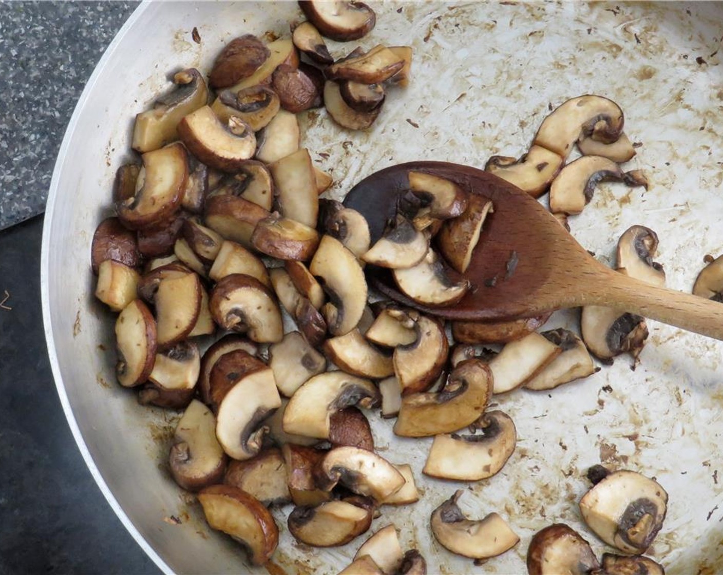 step 3 Add more Olive Oil (1 Tbsp) to the pan, and increase heat to medium high. Add baby bella mushrooms, and saute until mushrooms are browned and have given off their liquid, 5-7 minutes. Transfer the mushrooms to the shallots bowl.