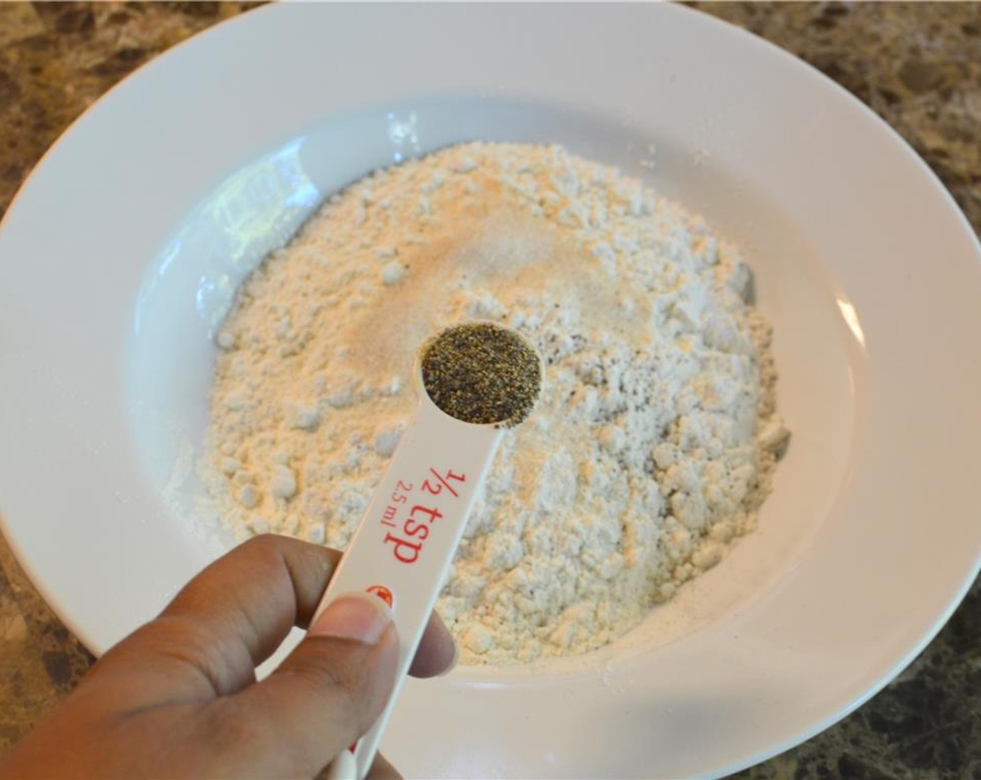 step 4 In another shallow bowl, mix together All-Purpose Flour (1 cup), the remaining Garlic Salt (1 tsp) and Freshly Ground Black Pepper (1/2 tsp).