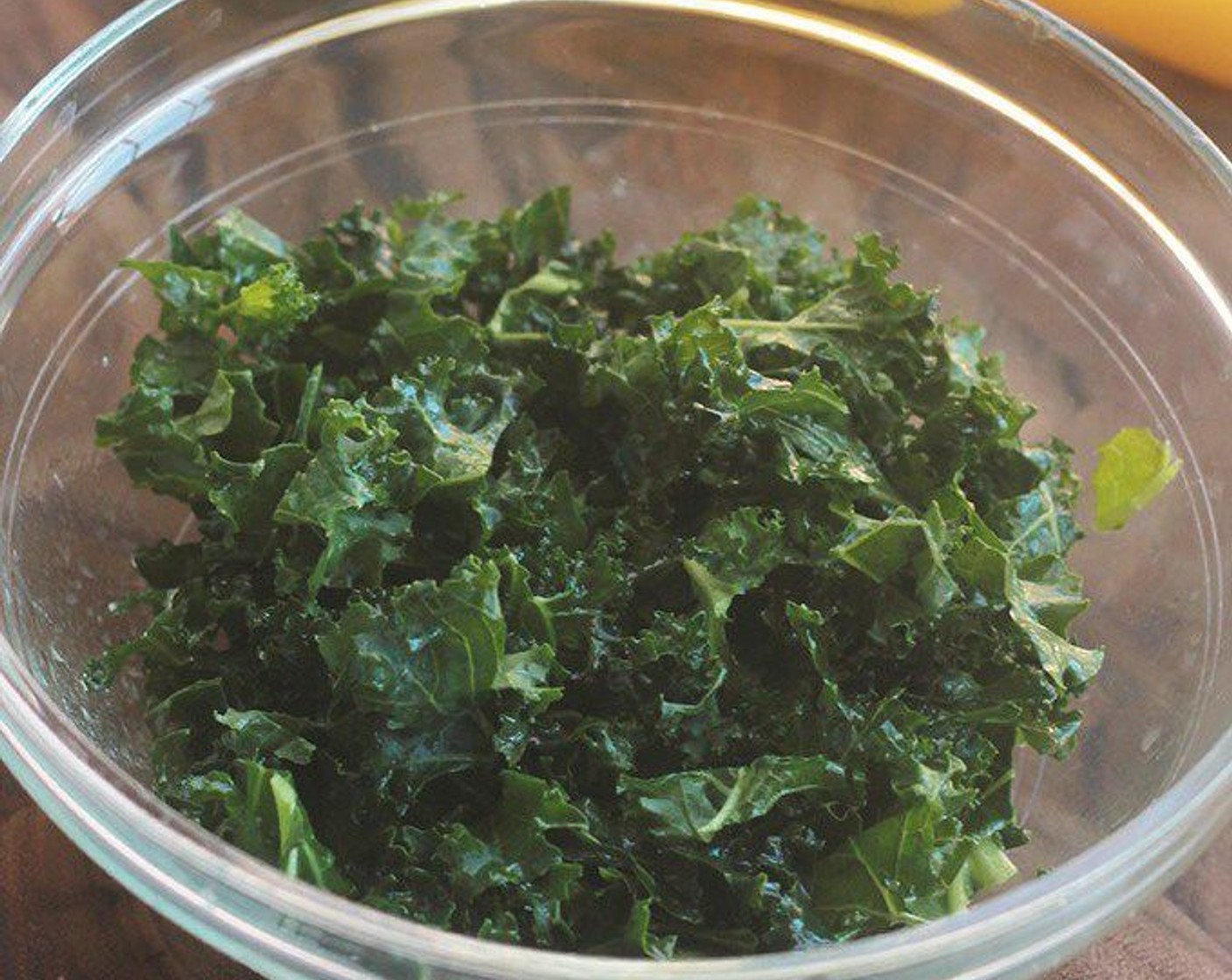 step 13 While couscous is cooking, place kale into a large bowl and drizzle with Olive Oil (1 Tbsp), juice of half a lemon and sprinkle with sea salt. Toss and massage kale between fingers until well coated, set aside.