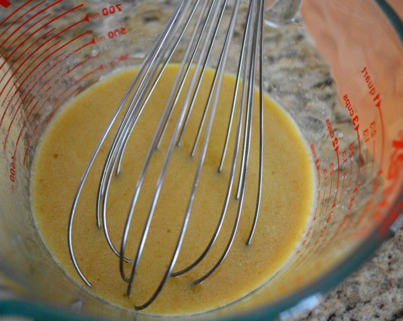 step 4 Whisk the Egg (1), Milk (1/2 cup), and Olive Oil (1/2 cup) together in another bowl for the wet ingredients.