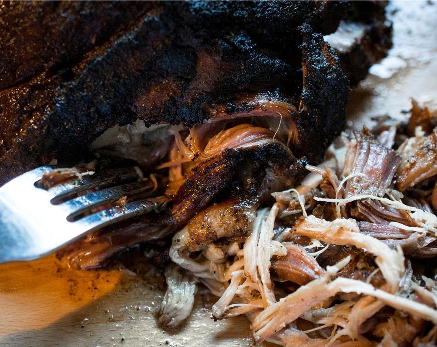 step 8 Remove the pork shoulder and let rest for 1 hour. Then pull apart with two forks.