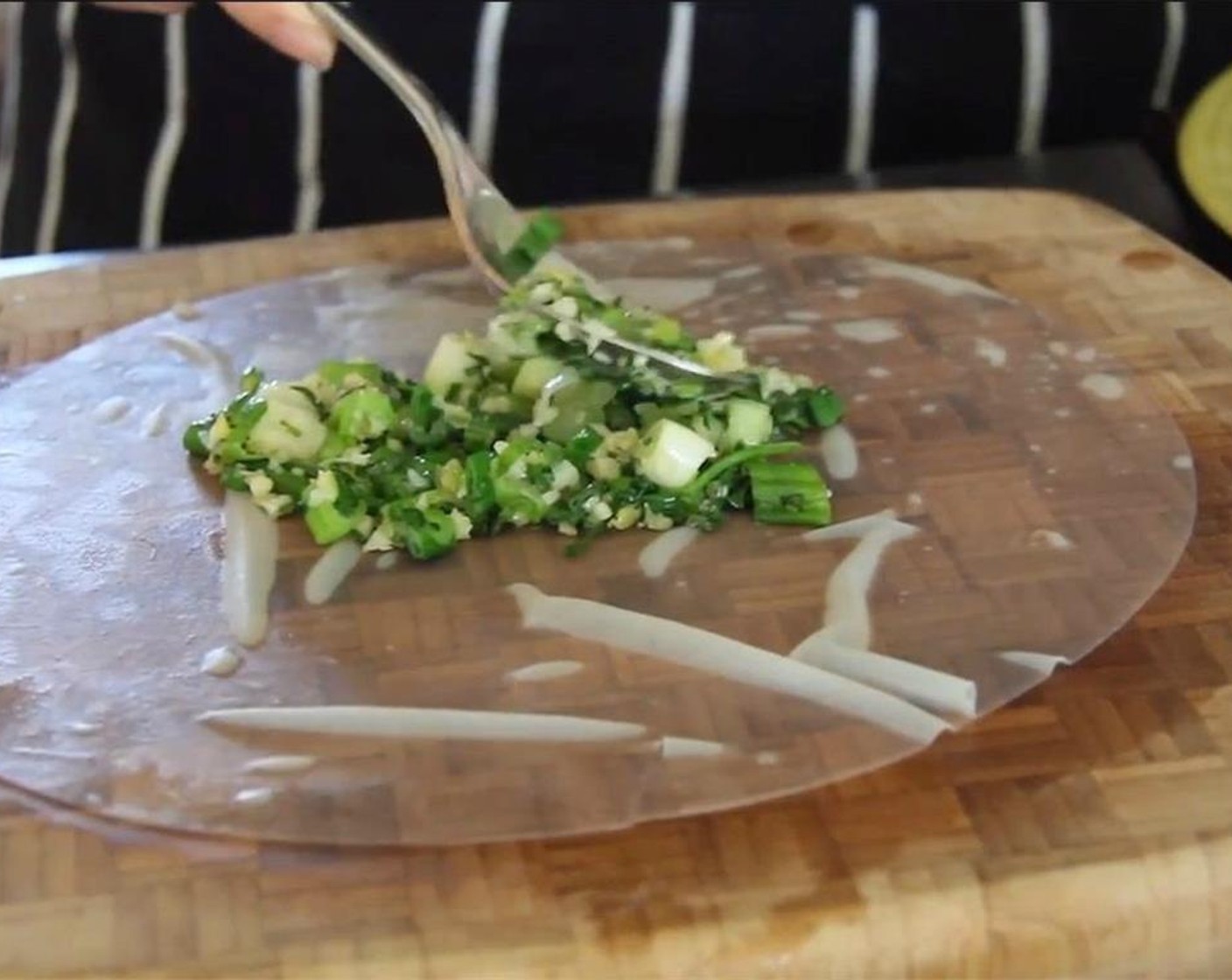 step 13 Put 1 heaping tablespoon of the ginger-garlic-herb mixture on the center of the rice paper and spread it around a bit, so that it will evenly cover the surface of a piece of salmon.