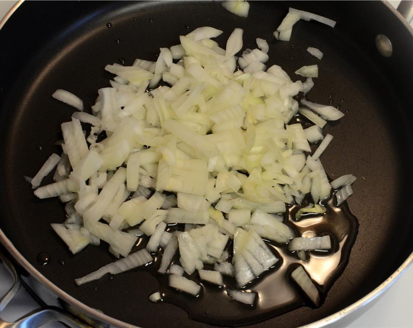 step 2 Toss in the Onion (1/2) and sautee till it turns soft and translucent.