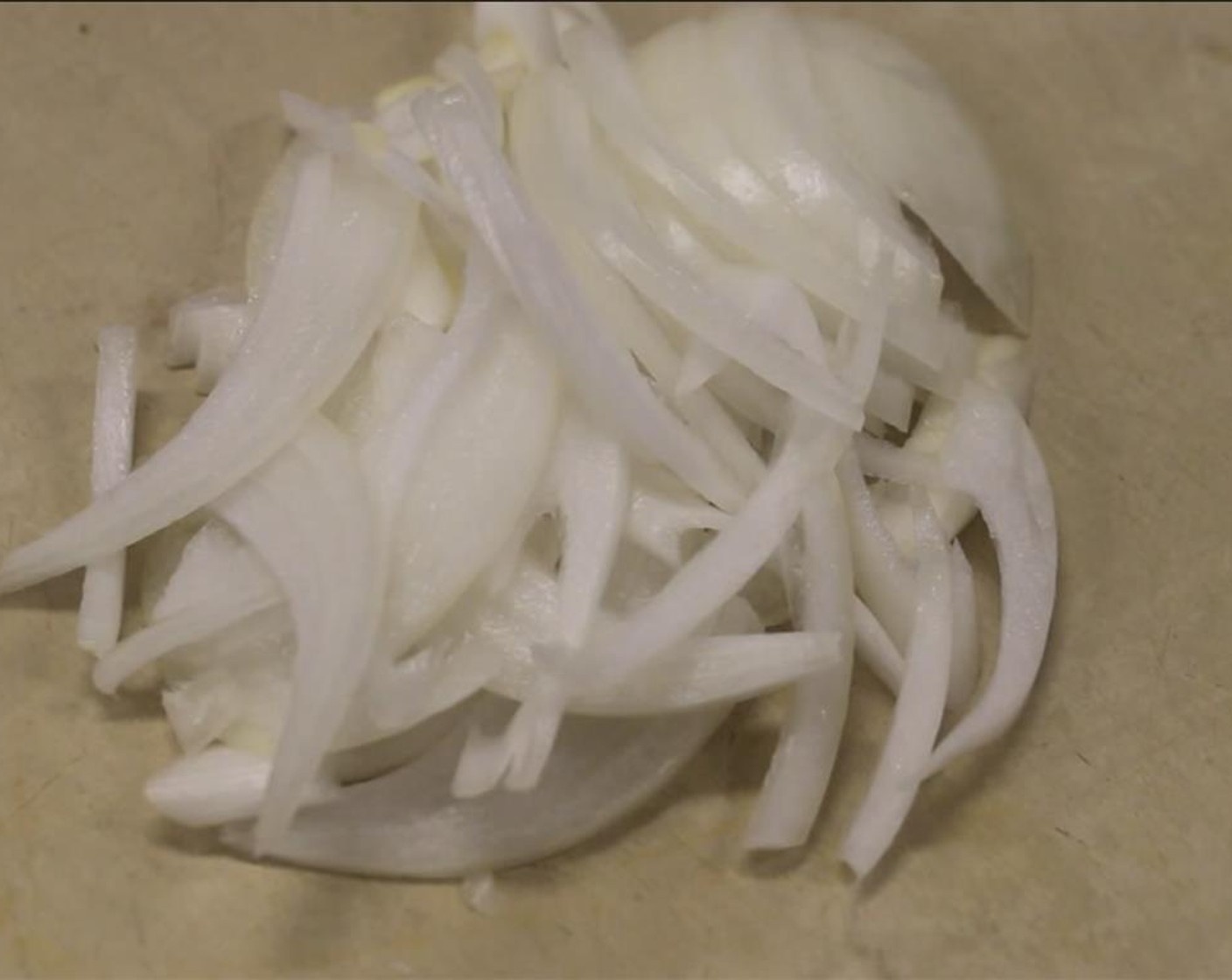 step 6 Cut Onion (1/3 cup) into strips.