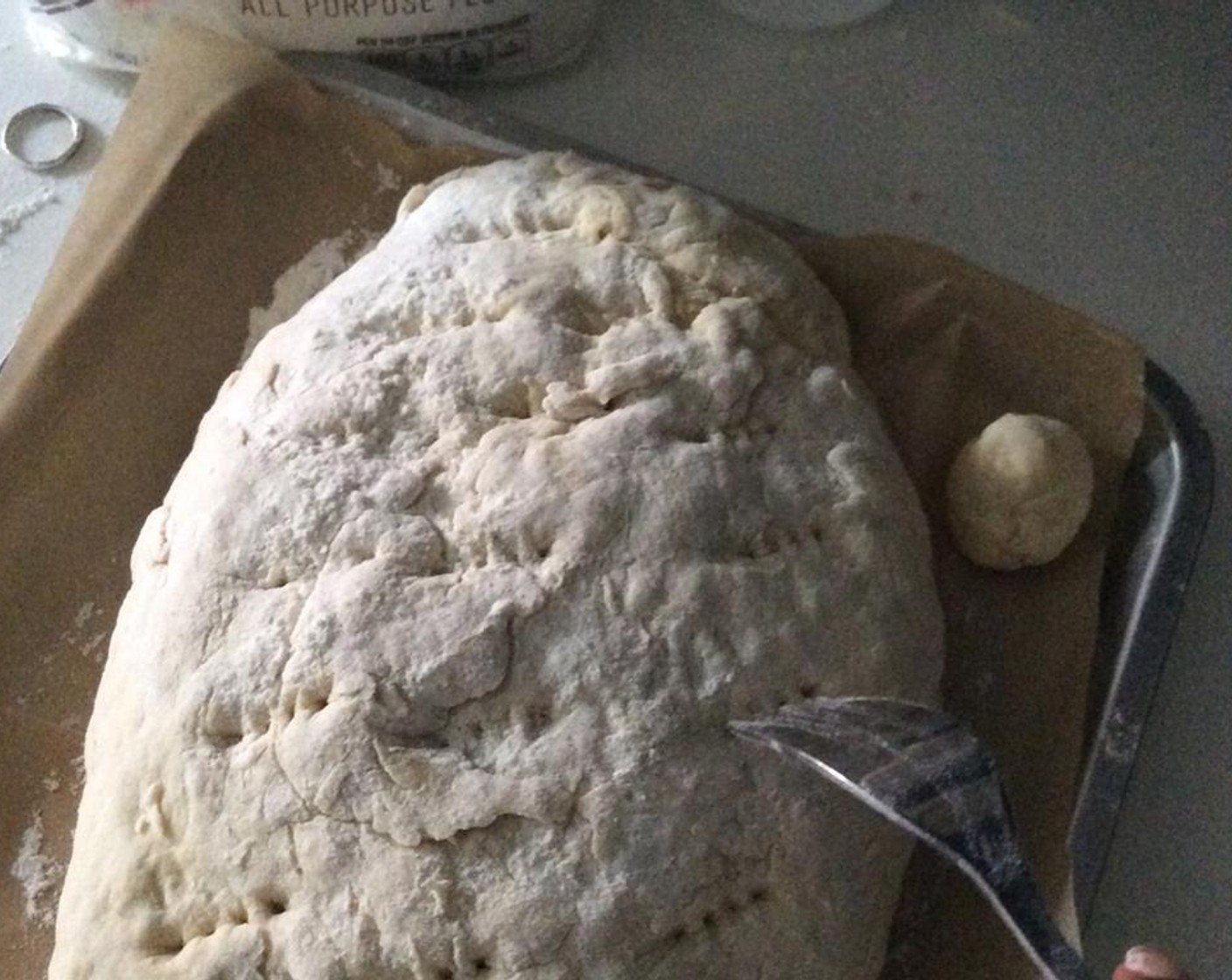 step 10 Place the dough on a pan with parchment paper. Form the dough into a nice lump with your hands. Use a fork to pierce several holes at the top for even baking.