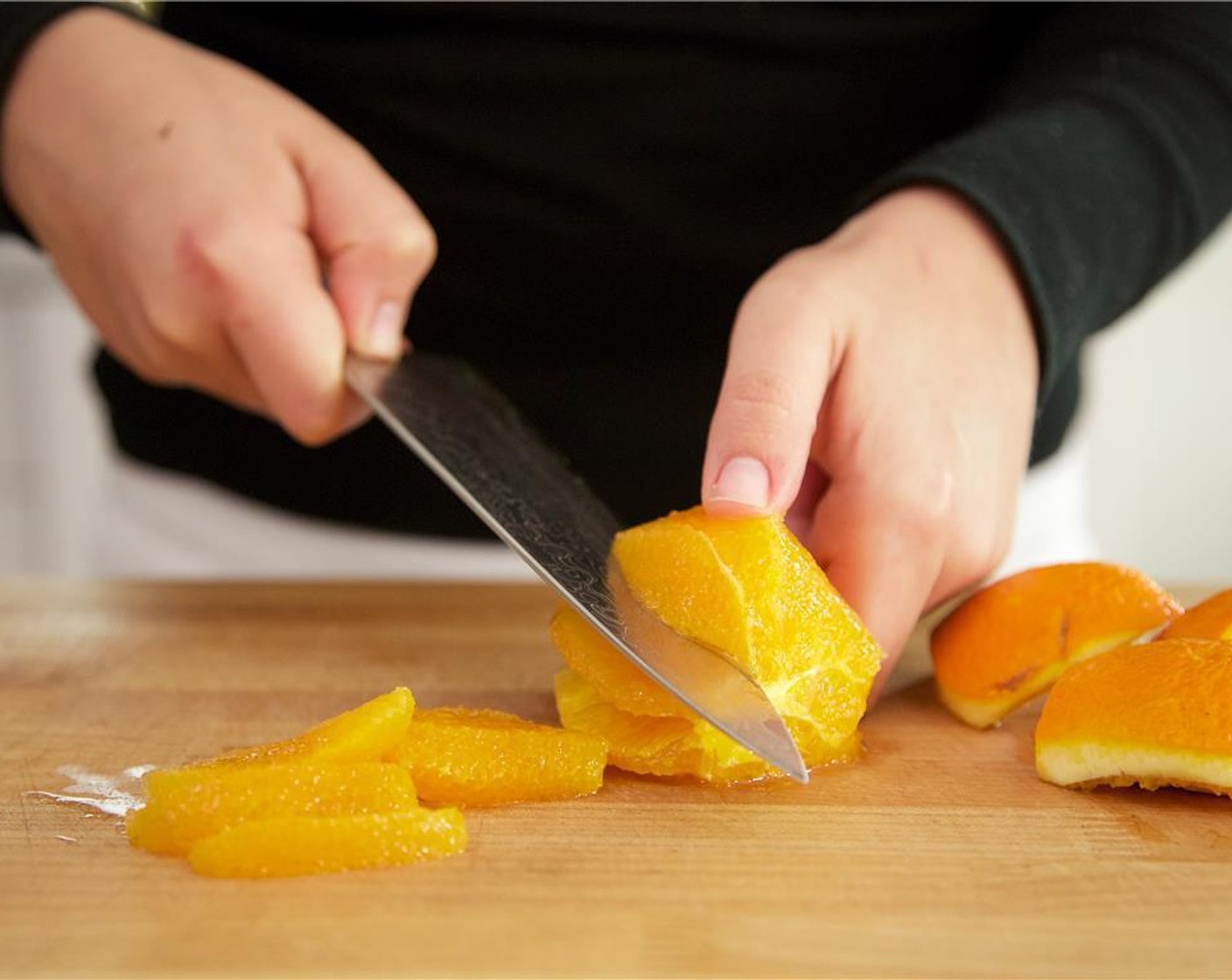 step 5 Zest the Oranges (2 1/2 Tbsp) and set aside. Slice off the bottom and top. Using even downward strokes, slice the skin away from the flesh. Discard skin, and remove any remaining white pith. Cut between the membranes to segment the orange.
