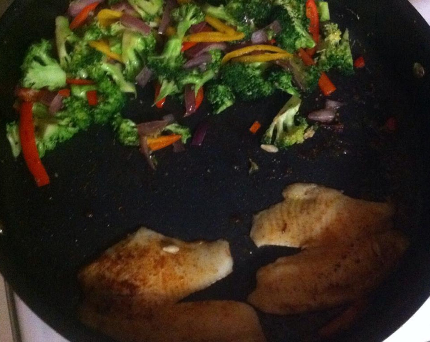 step 6 Place tilapia, broccoli, sweet mini peppers, red onion, in the skillet and cook on medium high for 5 minutes or until done.