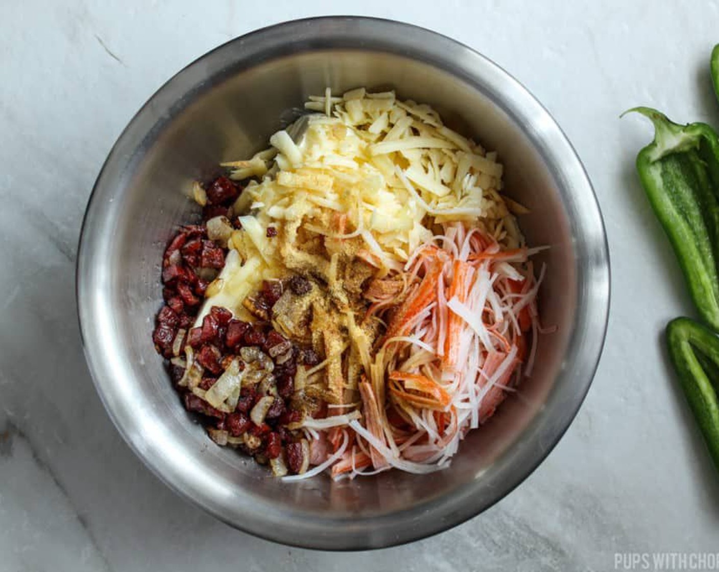 step 9 In a small bowl, combine the Cheddar Cheese (1 cup), Philadelphia Original Soft Cheese (1 cup), Soy Sauce (1 Tbsp), Honey (1/2 Tbsp), toasted onions and Chinese sausage, Imitation Crab (1 cup) and McCormick® Garlic Powder (1/2 Tbsp). Mix well.