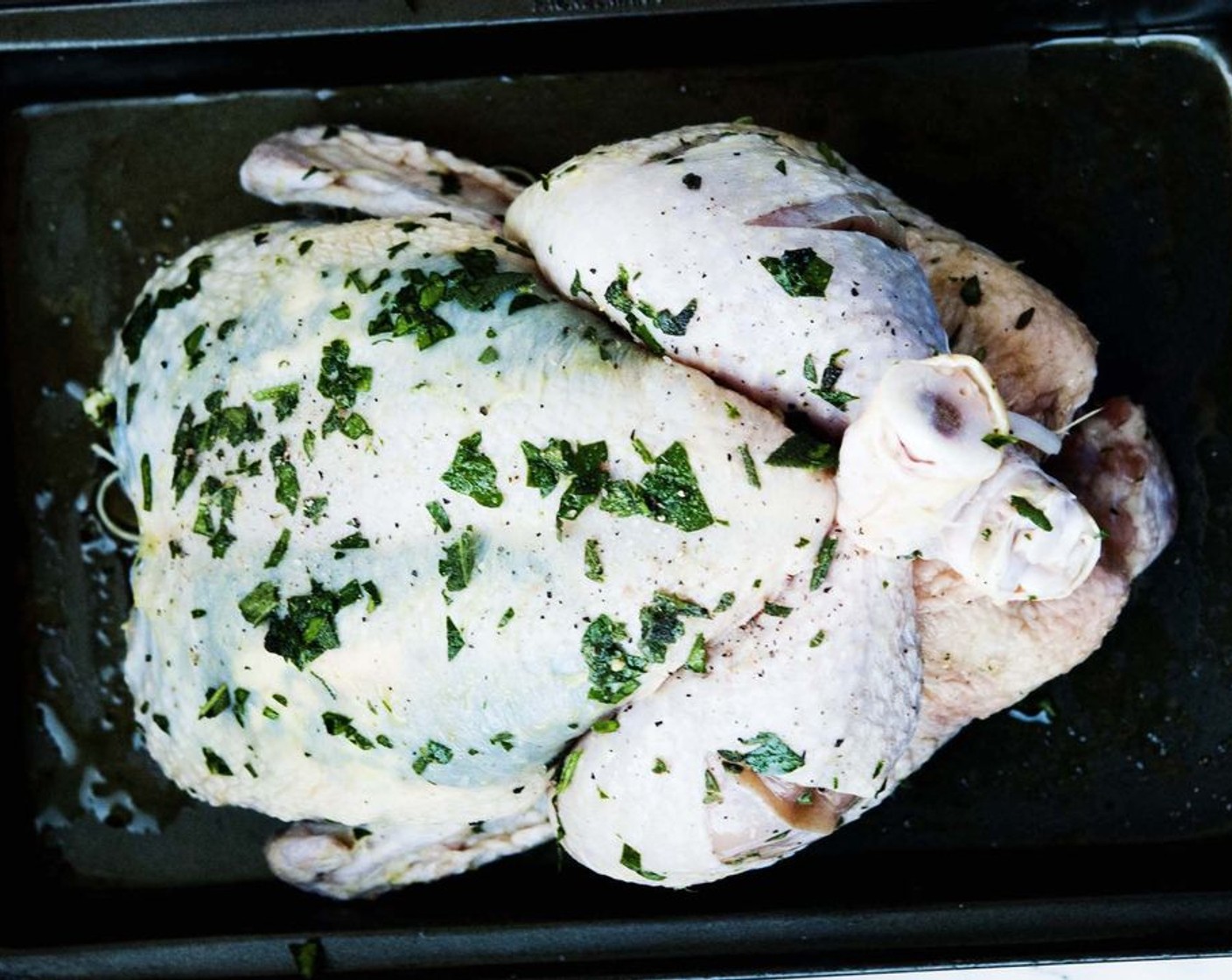 step 6 Slide most of the herbs under the skin of the chicken breast and then add 1/3 of the Butter (2 Tbsp) under the skin per side. Rub the remaining herbs and butter on the top and outside of the chicken.