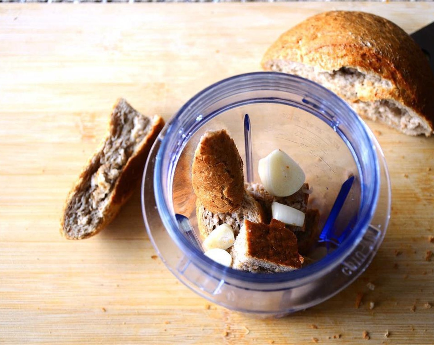 step 5 Place the Bread (1 slice) and Garlic (2 cloves) in a food processor, and pulse into fine crumbs.