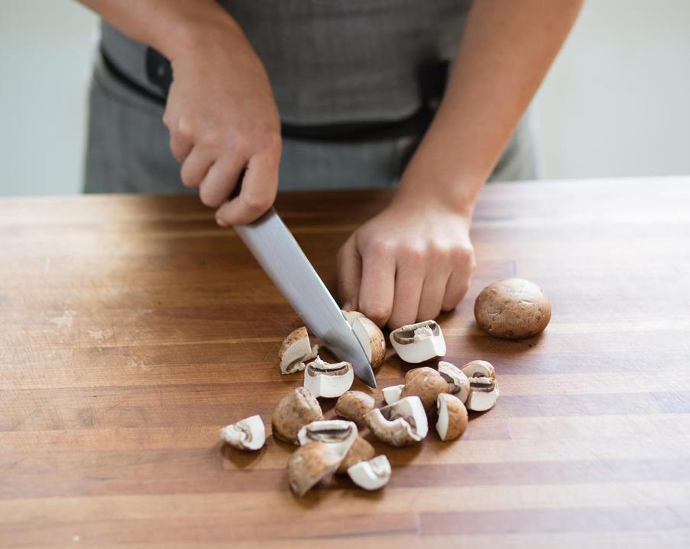 step 4 Meanwhile, remove the stems from the Cremini Mushroom (1 cup) and discard stems. Slice the mushroom into quarters; set aside.