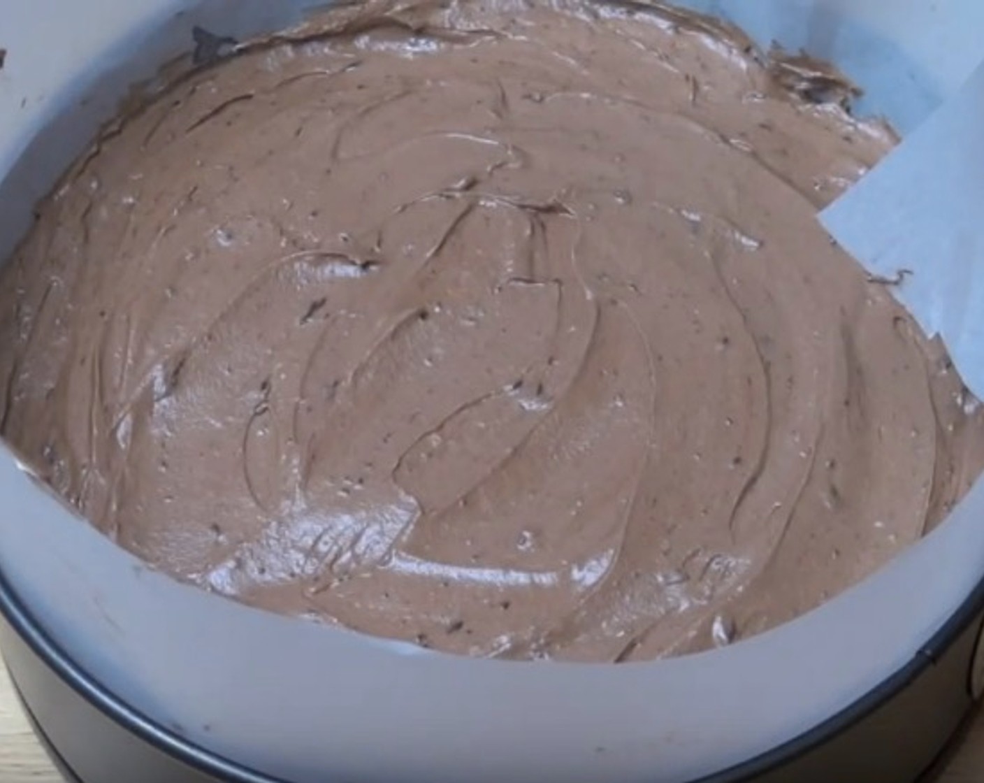 step 7 Transfer the mousse into the cake tin. Smooth the surface with a spatula. Place in fridge to chill for 3-4 hours, or until set.