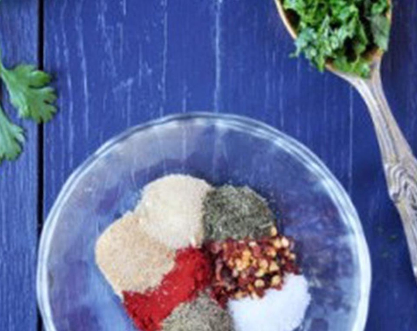 step 2 Combine Paprika (1 tsp), Sea Salt (3/4 tsp), Ground Black Pepper (3/4 tsp), McCormick® Garlic Powder (1/2 tsp), Onion Powder (1/2 tsp), Dried Dill Weed (1/2 tsp), Crushed Red Pepper Flakes (1/2 tsp), and Fresh Cilantro (1 Tbsp) in a bowl.